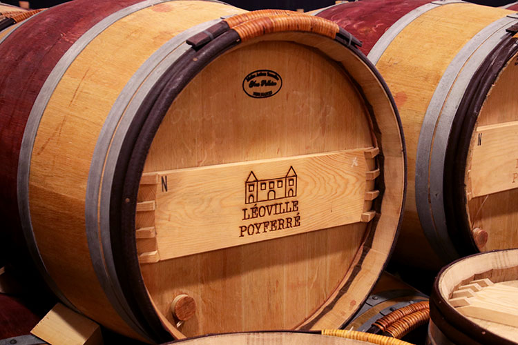 An oak wine barrel in the barrel room at Château Léoville-Poyferré