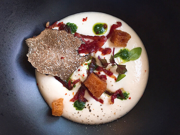 A cheese mouse topped with croutons, Iberico ham from Spain and a summer truffle at Le 7 Restaurant at La Cite du Vin