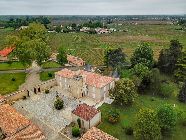 Drone aerial of Chatea Coutet and the surrounding vineyards