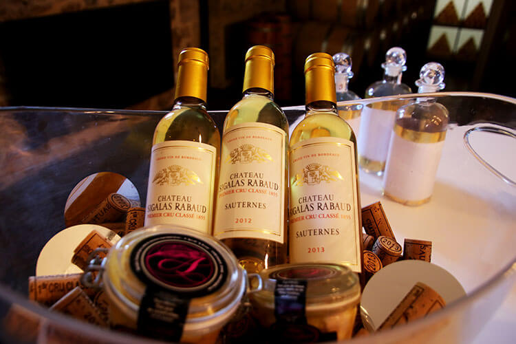 Bottles of Château Sigalas Rabaud and foie gras for sale in the boutique