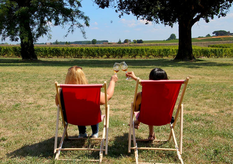 Jennifer and a friend enjoying wine on the terrasse at Château Sigalas Rabaud