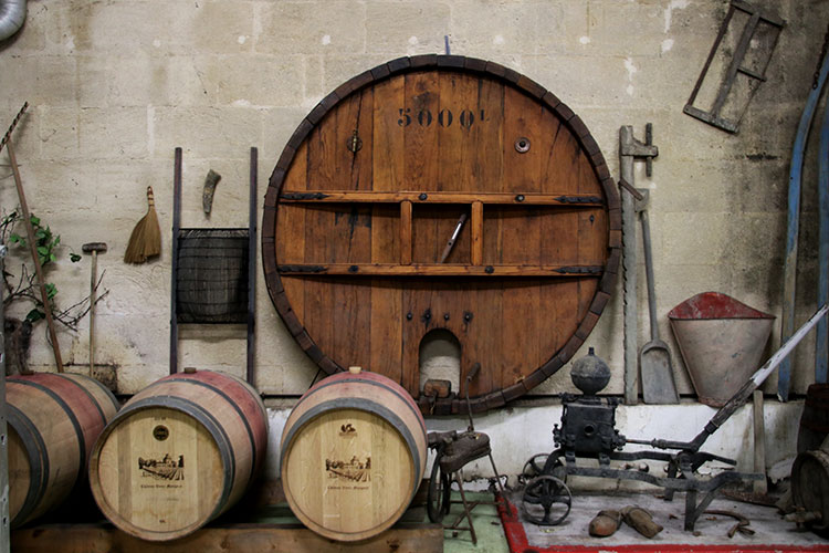 A collection of historic tools that were once used in the vineyards at Chateau Vieux Mougnac