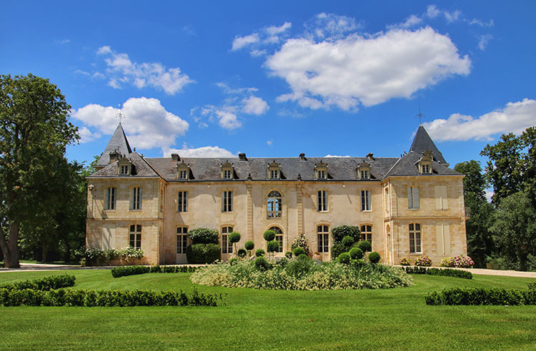 The castle of Reignac has two small towers on each end of the house and dates from the 16th century