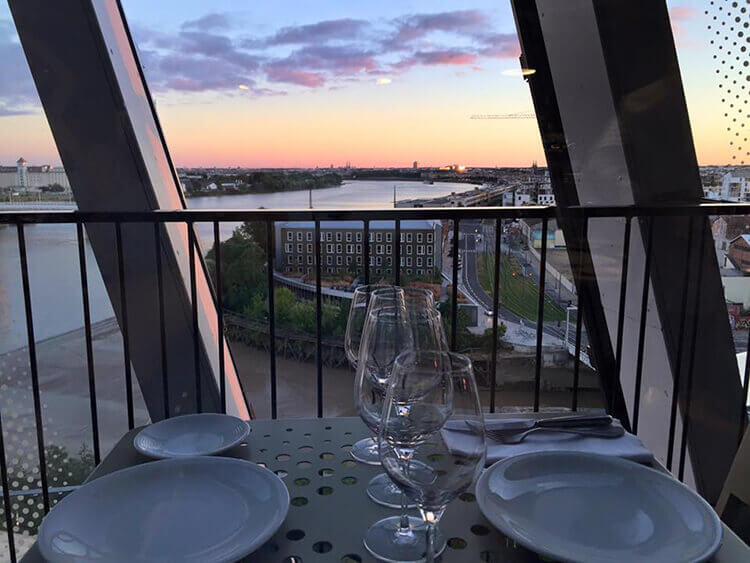 Sunset view of the Garonne River and Bordeaux from Le 7 Restaurant at La Cité du Vin