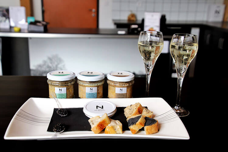 The tasting at Caviar de Neuvic with spoons of caviar, Sturgeon rillettes on baguette and caviar butter on baguette