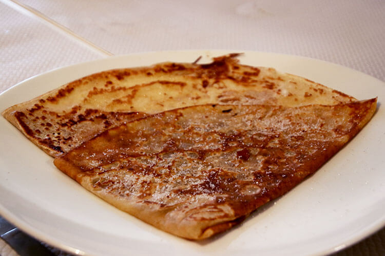 A classic sweet crêpe with butter and suger folded into a triangle at Ballet Christophe in Bordeaux