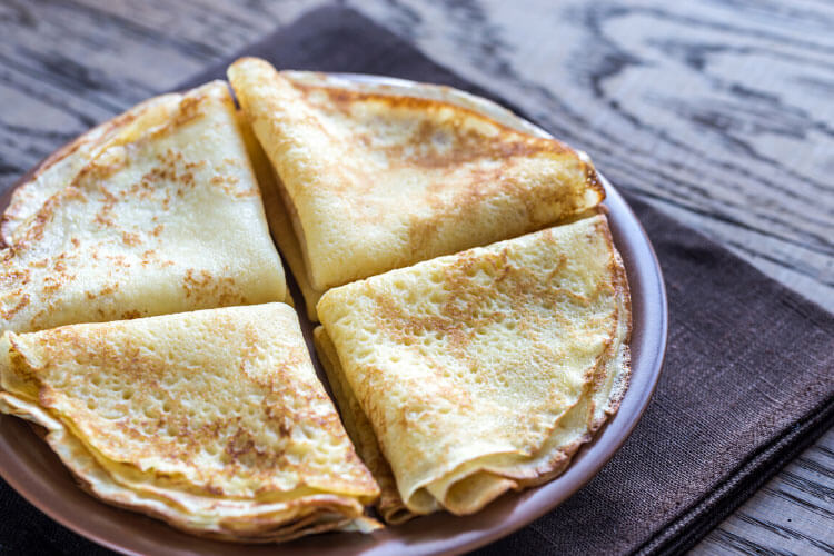 A plat of crêpes folded into triangles 
