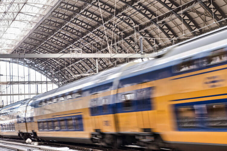 A train blurs by in the Gare de Bordeaux-Saint-Jean