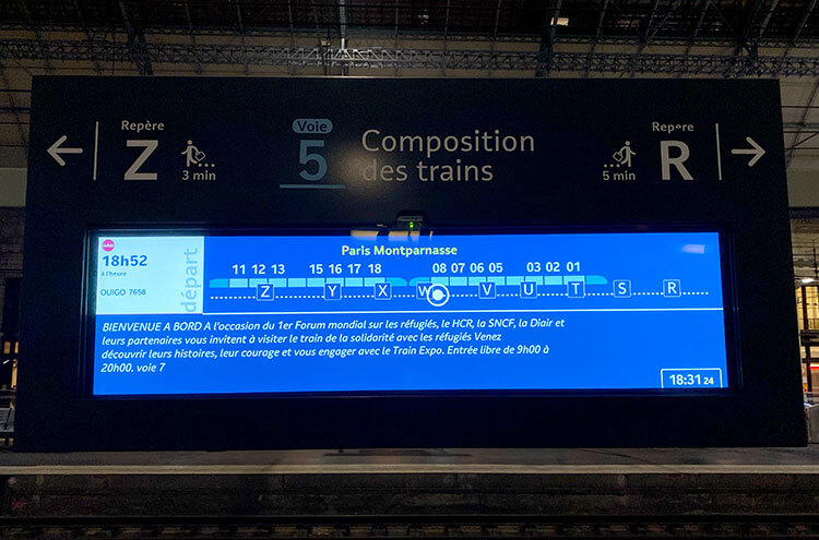 A screen on the platform displaying the layout of the train with the location of each coach