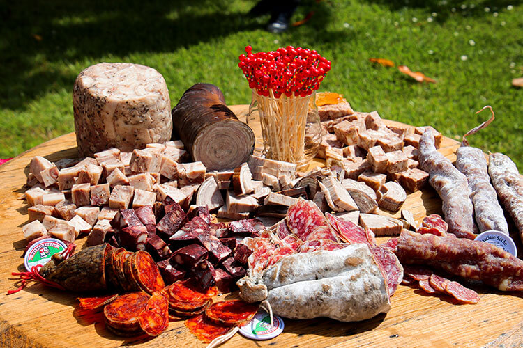 A charchuterie board of various salamis during the picnic lunch at Château Malescasse