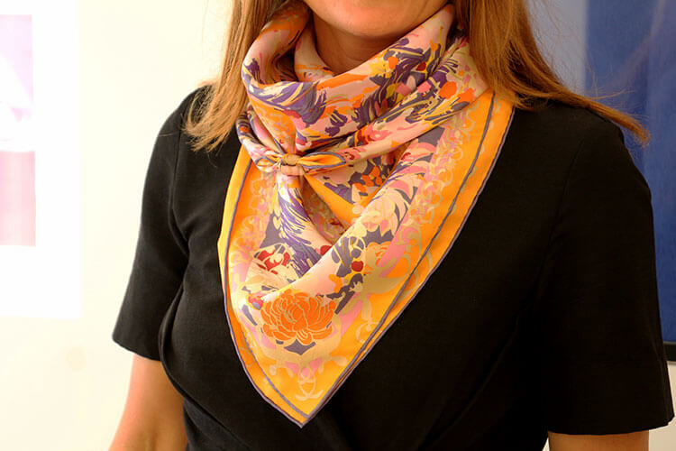 Learning to tie scarves in different configurations like this bandana style