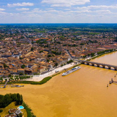 An aerial view of the confluence of the Dordogne and Isle rivers with Libourne's medieval monuments