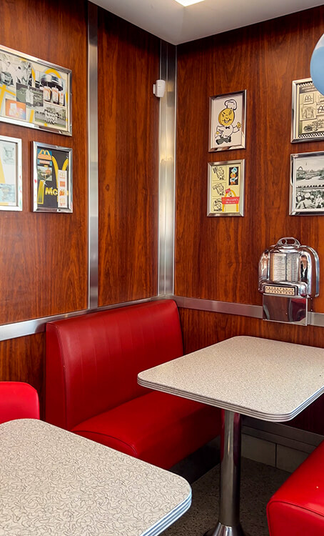 Booths are American diner style of the 1960s with individual coin operated juke boxes in each booth