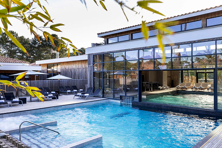 The spa pool from outside looking into the connecting indoor pool at Domaine du Ferret in Claouey, Lège-Cap-Ferret, France