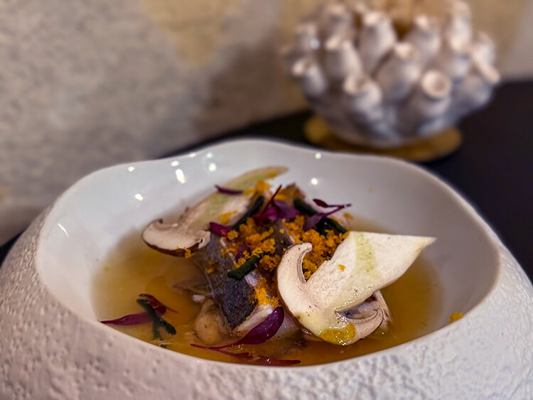 Amberjack with cèpes and amanites des Cèsars in a Thai broth at INIMA