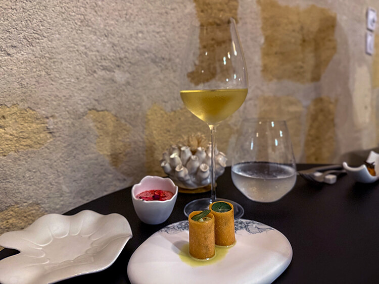 Oyster tartare with pomegranate and cuttlefish with wasabi paired with a white Bordeaux at INIMA