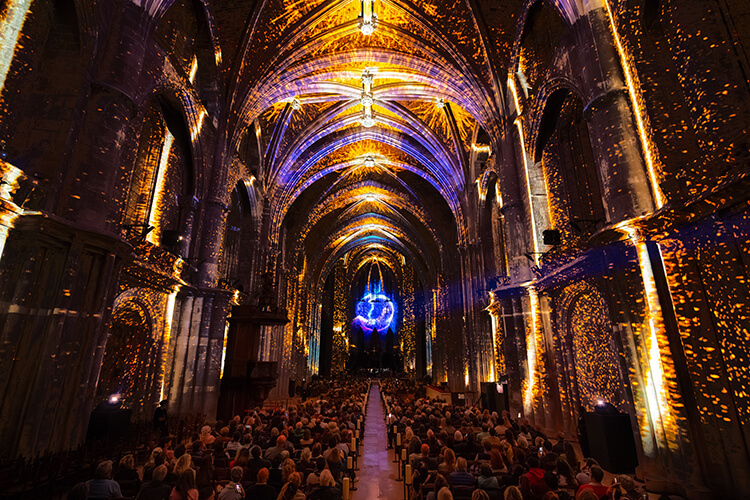 Cathedral Saint-André illuminated with stars and a celestial sphere during the LUMINISCENCE show in Bordeaux, France