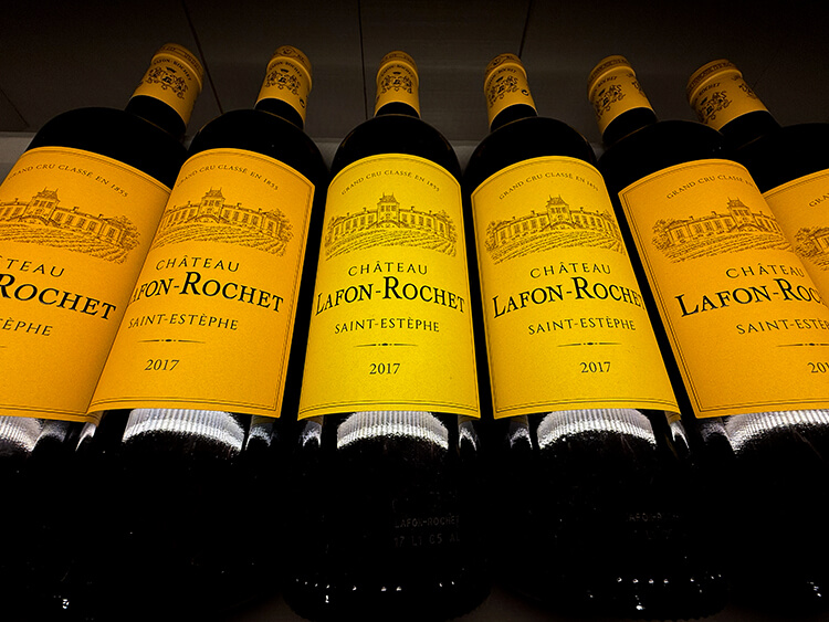5 bottles of Château Lafon-Rochet 2017 with their canary yellow labels