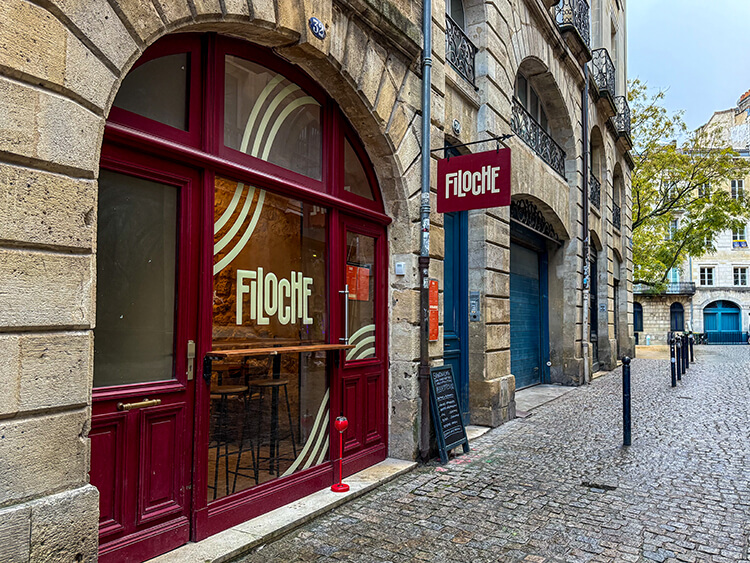 Red exterior of Filoche restaurant in Bordeaux