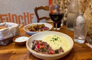 The pulled lamb plate with pickled vegetables and mashed potatoes and the pulled beef a la Bordelaise plate with roast baby potatoes at Filoche